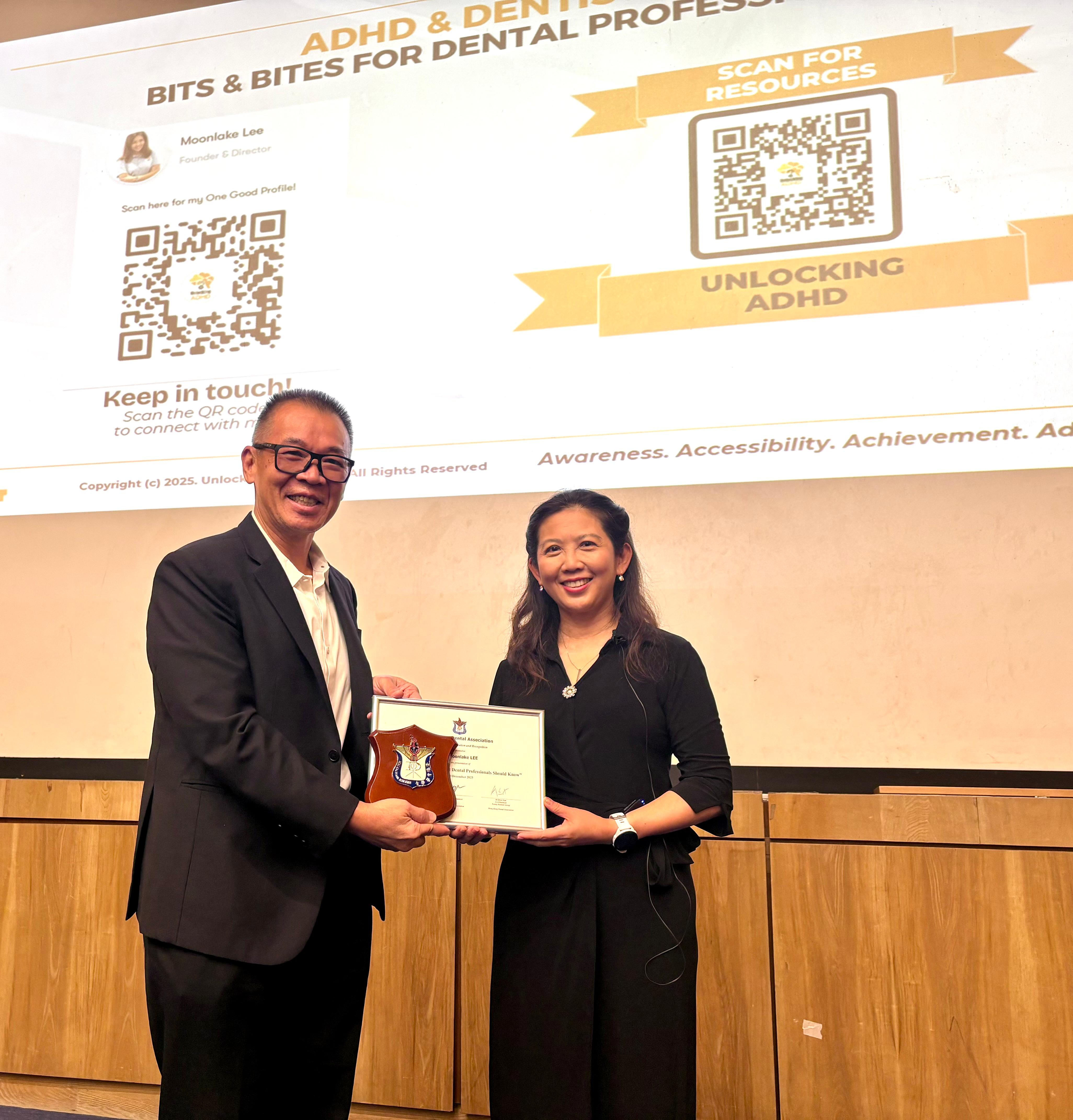 Moonlake Lee receiving a professional recognition award